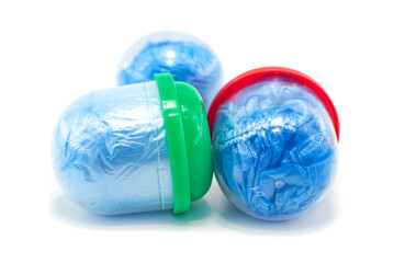 Blue shoe covers in a capsule on a white background. Shoe covers for leg protection