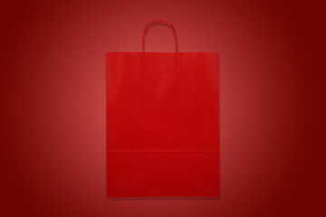 Red paper bag isolated in red background