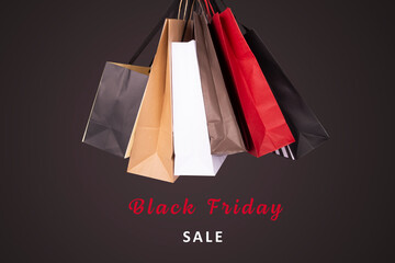 Black Friday Sale Sign and bags in a black background