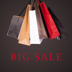 Big Sale banner with shopping bags on a black background