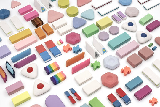 various shapes and colors of erasers arranged