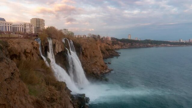 Day to night timelapse of Lower Duden Waterfalls in Antalya, Turkey. The Duden Waterfalls are a popular tourist attraction in Turkey.