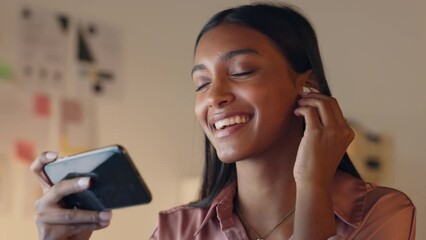 Phone, dancing and music, a woman with earphones watching video in office. Streaming, dance and listening to radio online at night. Smartphone, internet and fun at work with favorite new party song.