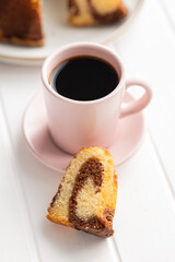 Sweet sponge cake. Bundt cake and coffee cup.
