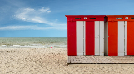 Row of vintage wooden beach huts on the beach of Dunkirk in France