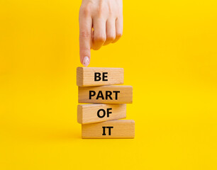 Be part of it symbol. Concept words Be part of it on wooden blocks. Beautiful yellow background. Businessman hand. Business and Be part of it concept. Copy space.