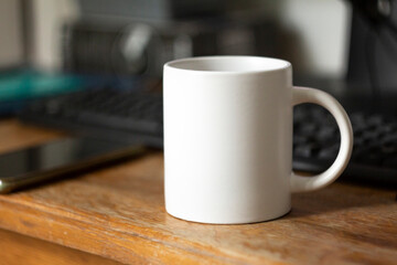 White mug on the desktop - 532280925