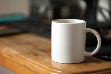 White mug on the desktop - 532280984