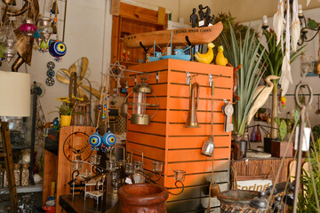 Colorful vintage item on the with a bell background of a light blue door in the old city of Safed. In Israel in a spectacular antique store