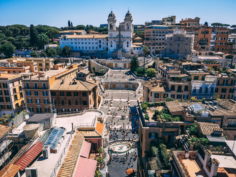 Daytime busy aerial view of Spanish Steps (Piazza di Spagna) in Rome, Italy. Busy touristic place.