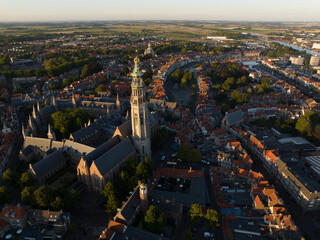 Obraz premium The Abbey Tower 90.5 meter high church tower in the abbey complex in Middelburg. Nicknamed the Lange Jan. Amoung tallest church towers in the Netherlands. Urban city overview in Zeeland Walcheren.