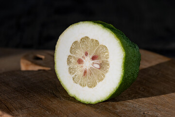 Close up on a citron (Citrus medica) fruit. It is a large fragrant citrus fruit with a thick rind.