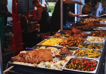Whole roasted pig for sale at open market.