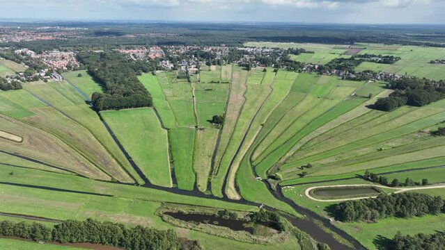 Loosdrecht recreational water river and meadow rural grass land green marsh in beautifull pattern small rivers and waters in nature. Dutch holland flat country side nature. Aerial drone.