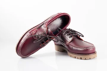 Fotobehang Male red leather shoes pares on white background, isolated product. © GeorgeVieiraSilva
