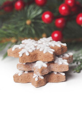 Christmas decoration. Christmas tree branches and homemade decorated Christmas cookies, close up image.	
