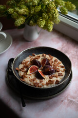 Oatmeal for breakfast with figs and agave syrup
