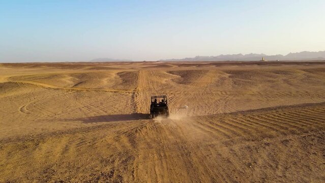 A black buggy car tripping the eastern desert in Egypt.