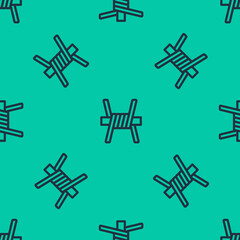 Blue line Barbed wire icon isolated seamless pattern on green background. Vector