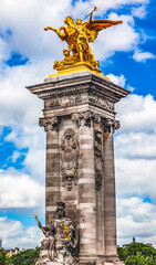 Fototapeta na wymiar Golden Fame Winged Horse Statue, Pont Bridge Alexandre III, Paris, France. Bridge over Seine River over Paris, built 1900