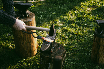 Blacksmith's workshop in the open air. The process of forging a knife.