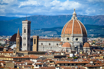 Fototapeta na wymiar Florence, Italy: Historic buildings in city centre. Popular tourist destination. Panoramic view of old city of Firenze. Florence Cathedral. Santa Maria del Fiore. 