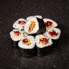 tasty sushi on the black background