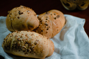 three loaves in a white handkerchief on an abstract background