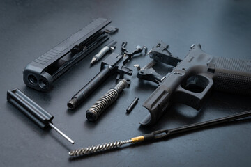 Firearms, disassembled gun for cleaning.