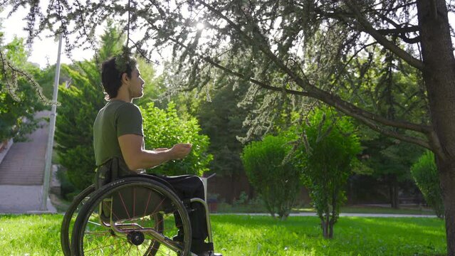 Disabled youth sitting in a wheelchair praying.
Prayer. Young disabled person sitting in wheelchair praying.
