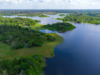 Aerial view of Igapó, the Amazon rainforest in Brazil, an incredible green landscape with lots of water and untouched nature