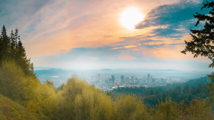 Portland city skyline under wildfire smoke at sunrise. Autumn cityscape with haze and obscured visibility in Washington State.