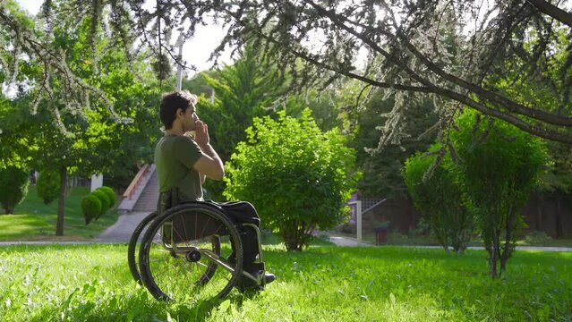 Christian physically disabled youth praying.
Prayer. Young disabled person sitting in wheelchair praying.
