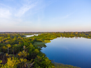 Aerial view of Igap&oacute;, the Amazon rainforest in Brazil, an incredible green landscape with lots of water and untouched nature at sunset time