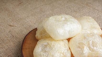 Crispy cracker snack made from fried cow's skin. Kerupuk Kulit one of Indonesian traditional crackers. Selective Focus