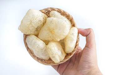 Kerupuk kulit on wicker bamboo. Kerupuk Kulit is a traditional snack from Indonesia. selected focus