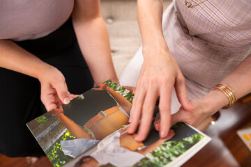women reading a book together