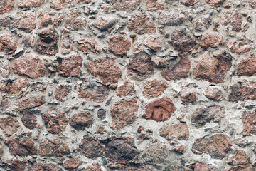 old stones wall with concrete background