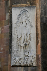 Colmar, France. Old town Colmar which was founded in the 9th century. Carving of Mary and Jesus on side of a church.