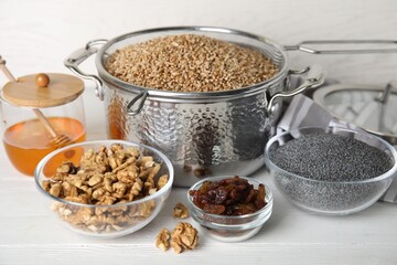 Ingredients for traditional kutia on white wooden table