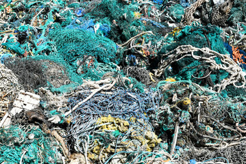 A large pile of trawler fishing nets, ropes and debris dredged up from the  Port of Los Angeles. Fishing nets are a major source of ocean pollution.