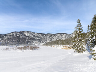 Fototapeta na wymiar Valley of river Rissbach after heavy snowfall near village Vorderriss during winter. Germany, Bavaria