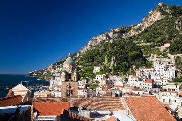 Fototapeta na wymiar Italy, Amalfi. Light on the Cathedral of St. Andrew and the town of Amalfi.