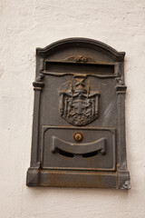 Italy, Tuscany. Old Italian letter box on the wall of a home.