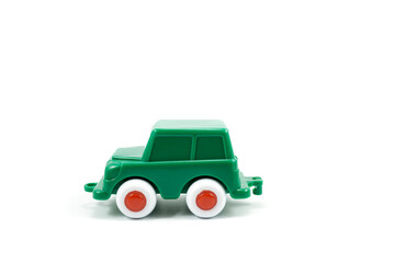 Green paint plastic toy terrain car isolated on white