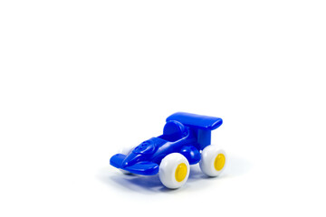 Blue paint plastic toy racing car with number three isolated on white