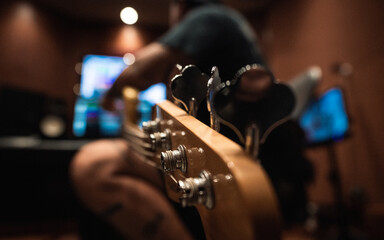 Veteran Playing Bass in Recording Studio 