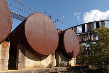 Three rusty old oil tanks from former Caltex oil refinery at Ballast Point, Birchgrove, Sydney,...