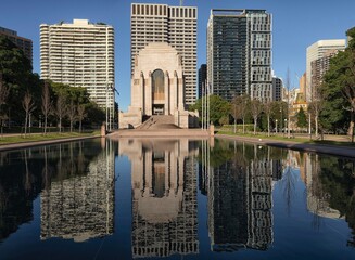 Northern side of Anzac Memorial in Hyde Park with pool of reflection reflecting the memorial and...