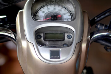 Speedometer numbers on the dashboard of a motorcycle.